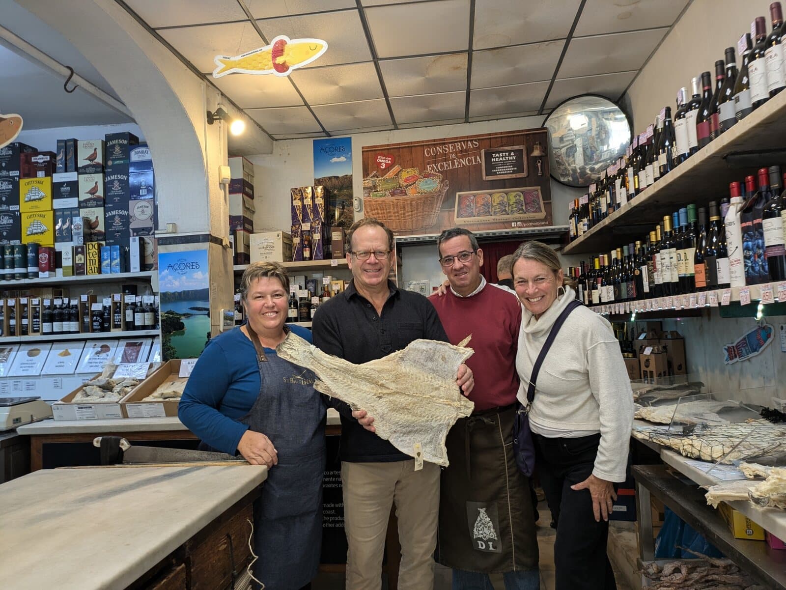 Guests with the owners of a traditional Lisbon food shop