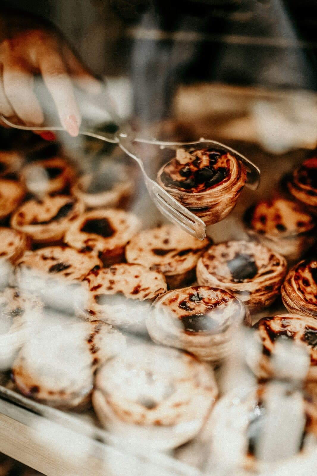 Fresh Portuguese pastries being prepared