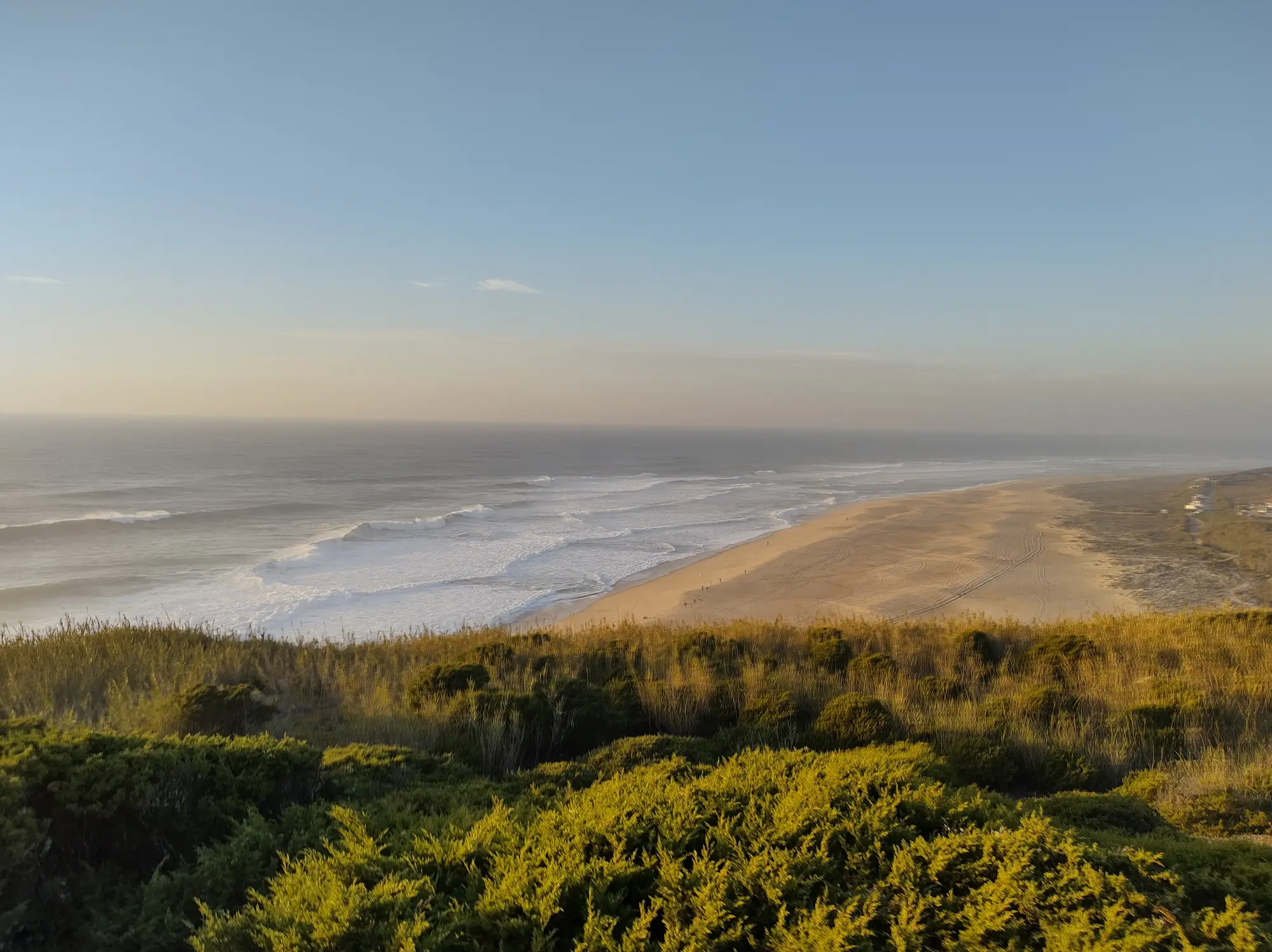 Praia do Norte stretching along the Atlantic at sunset