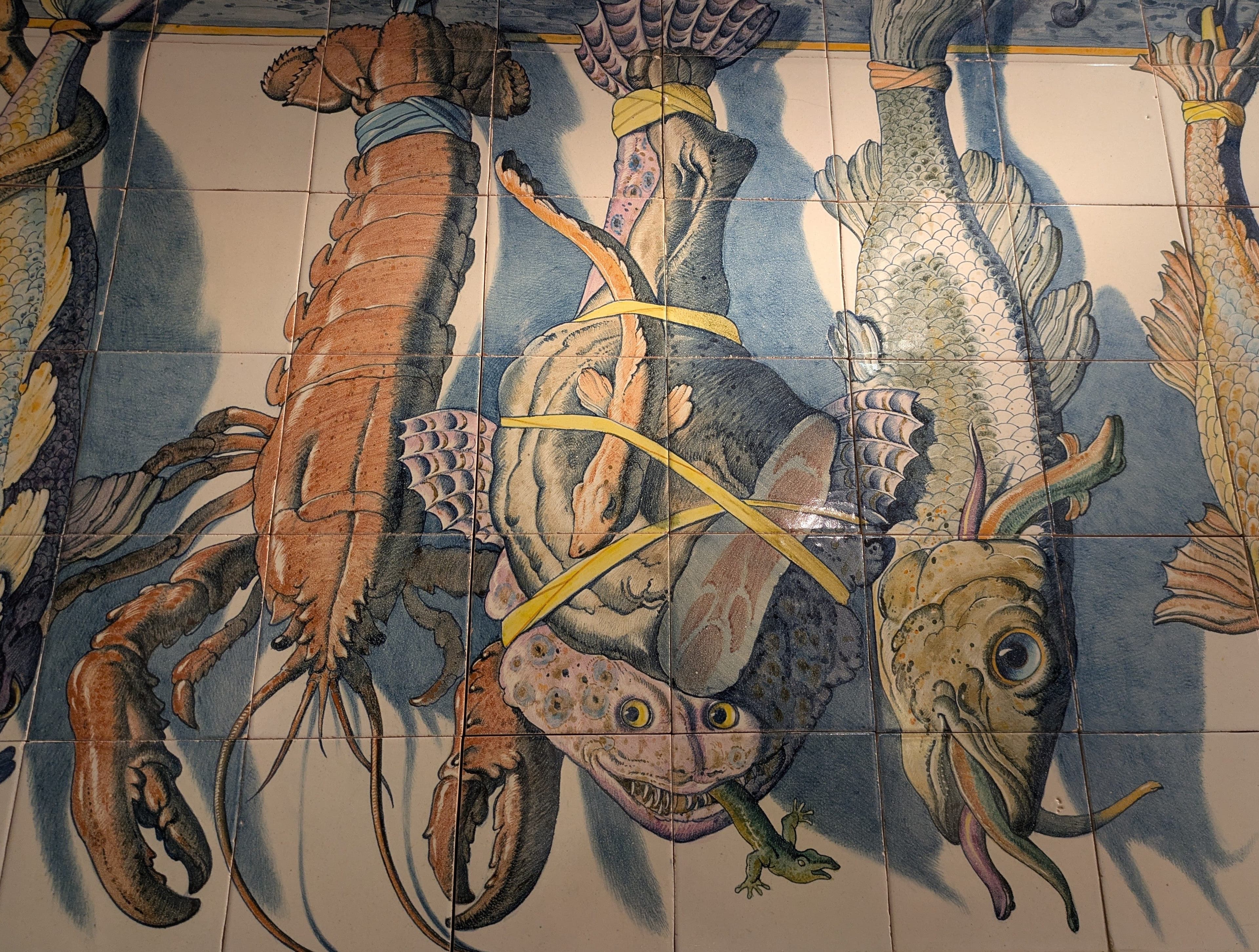 A richly illustrated Portuguese tile panel with fish and sea creatures