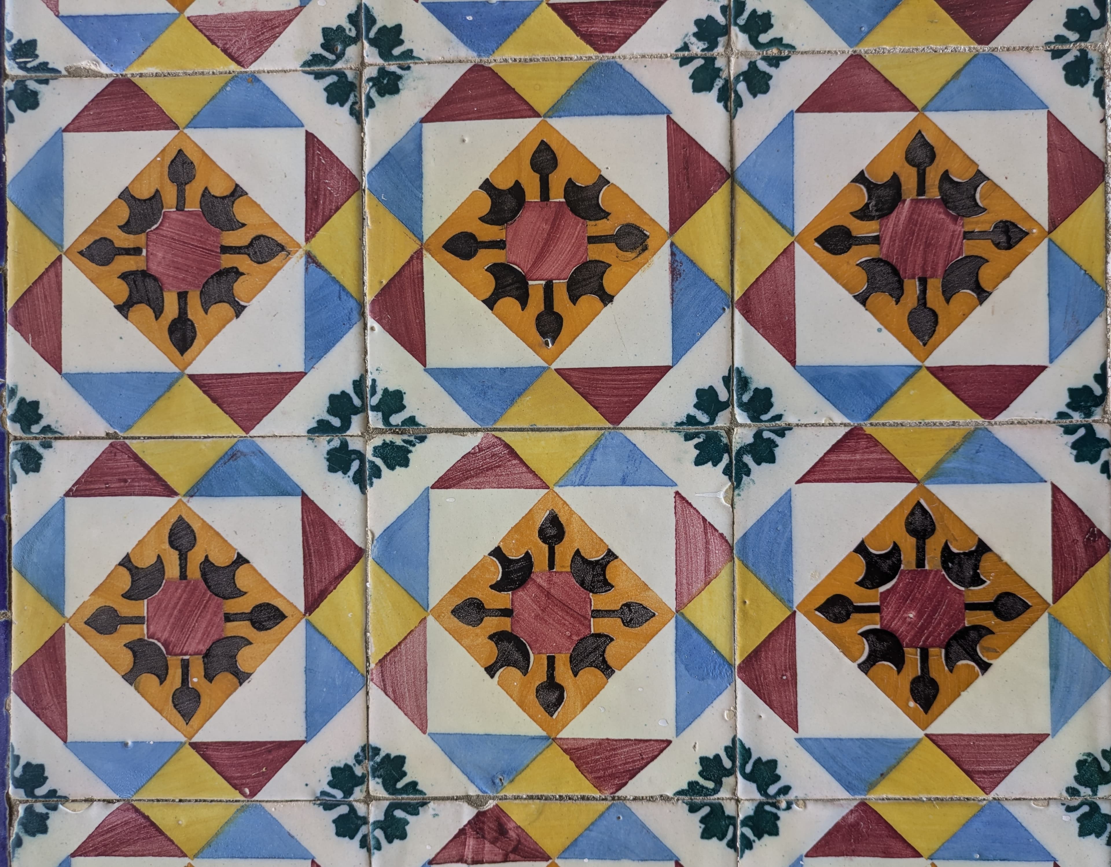 Colorful geometric Portuguese azulejos in a repeating pattern