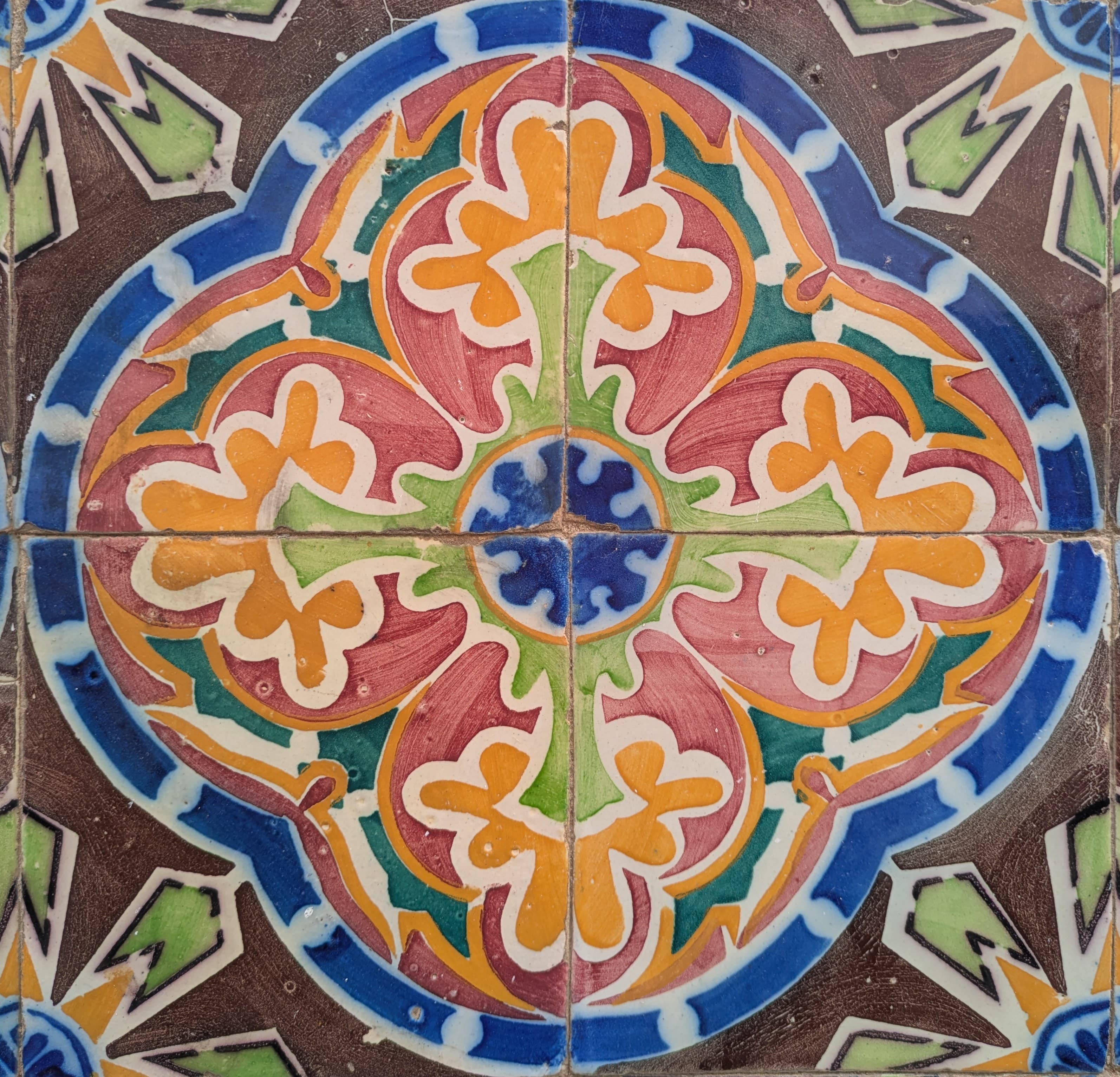 A multicolor Portuguese tile panel with a floral medallion