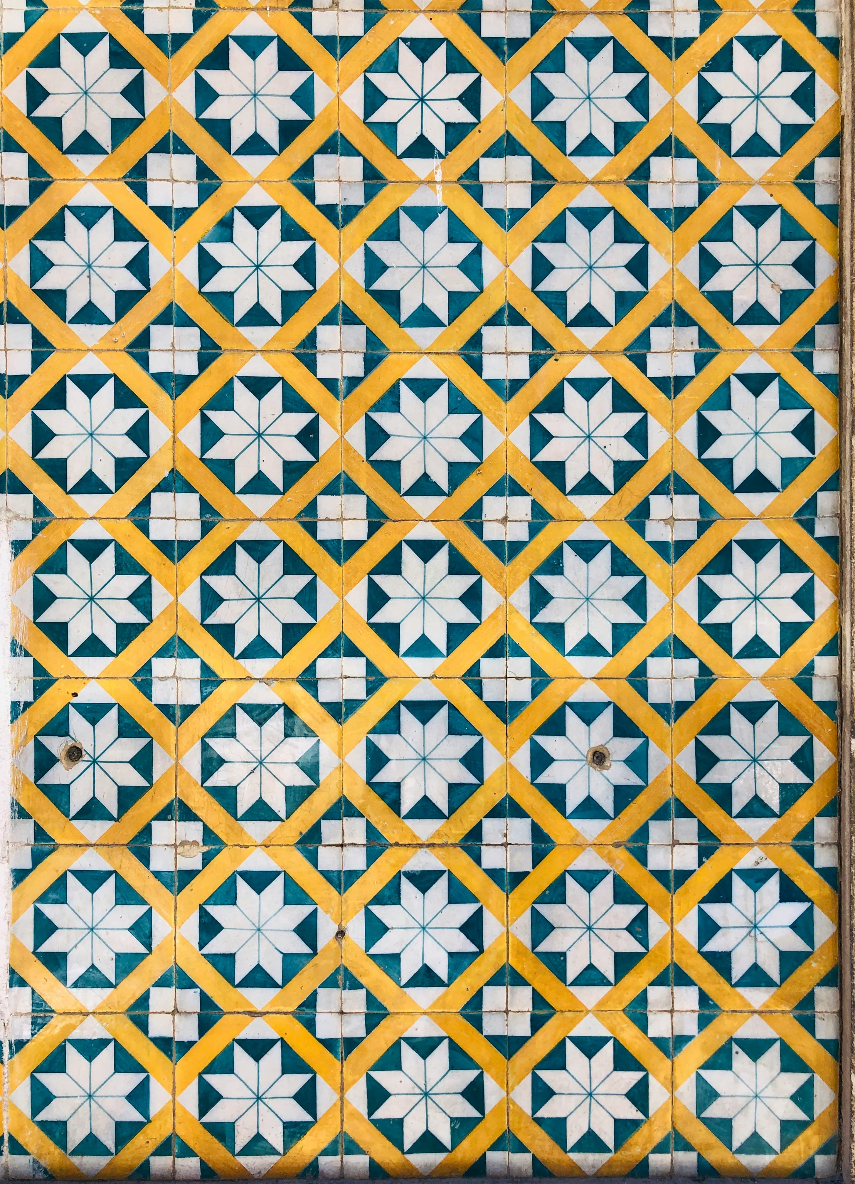 A blue-and-white Portuguese tile panel depicting architecture and figures