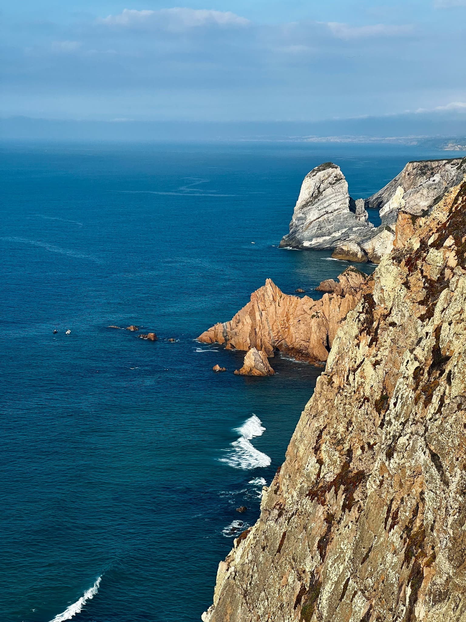 The dramatic rock formations and cliffs of Cabo da Roca meeting the Atlantic Ocean