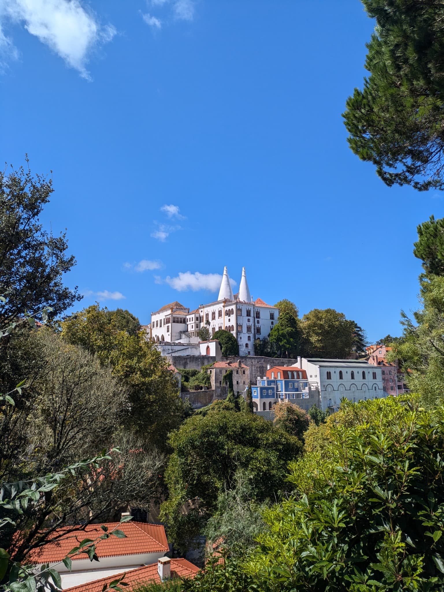 Sintra's hilltop village beneath the twin conical chimneys of the National Palace